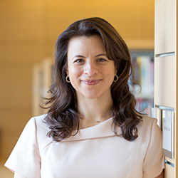 Portrait of joanna christodoulou standing in her office