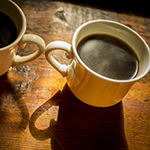cups of coffee on a wooden table