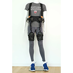 Soft robotic exosuit worn around the hips and thighs.
