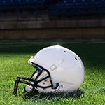 a white football helmet on green grass