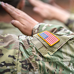 a closeup of a us military member saluting