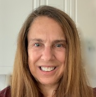 Portrait of Pamela silver standing in front of a white background