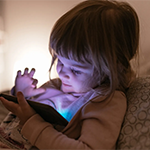 a child using a smart phone