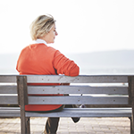 a woman sitting on a bench