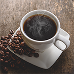 a cup of coffee and some coffee beans