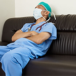 a doctor sleeping on a couch