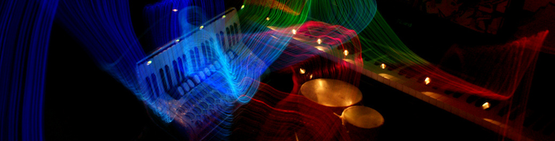 musical instruments with waves of color emanating from them