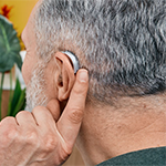 a person wearing a hearing aid