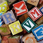 colorful child's blocks with letters on them