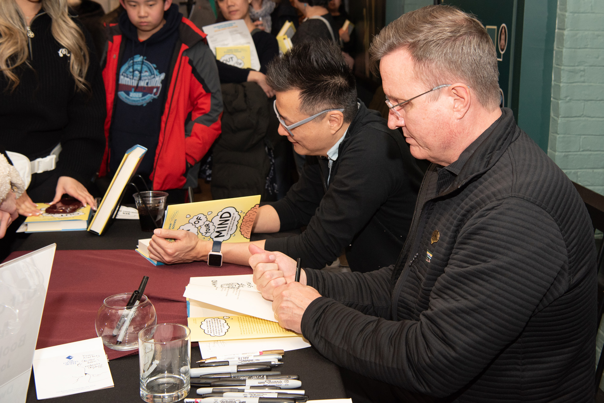 dwayne godwin and jorge cham signing copies of their book at the Harvard museum of natural history