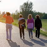 a group of 4 people walking