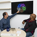 Kempner Co-Director Bernardo Sabatini (left) and Kempner Senior AI Computing Engineer Bala Desinghu (right) use a new desktop supercomputer to study how disruptions to neurons in the brain can drive neurological disorders such as epilepsy.